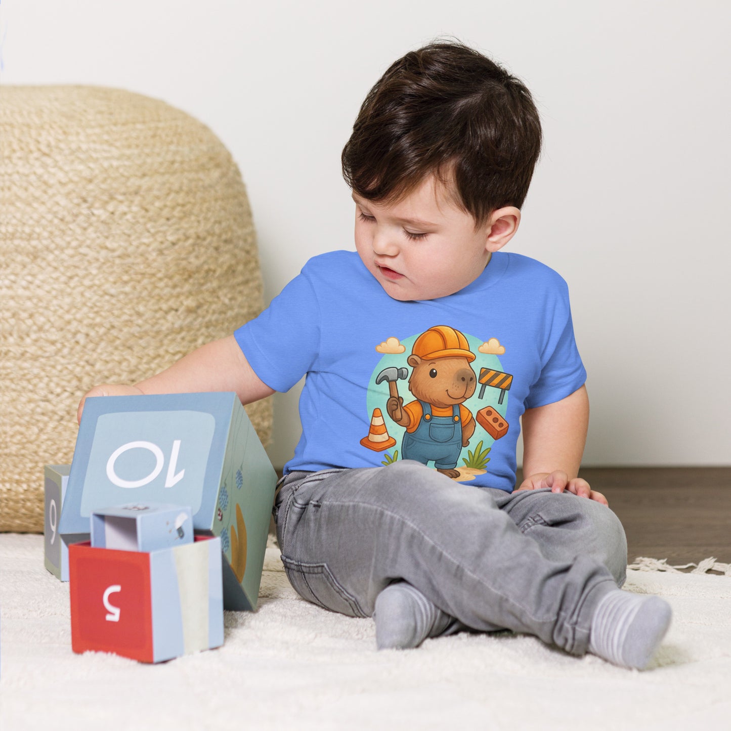 Close-up of cute Capybara Builder design with tools on a child's t-shirt