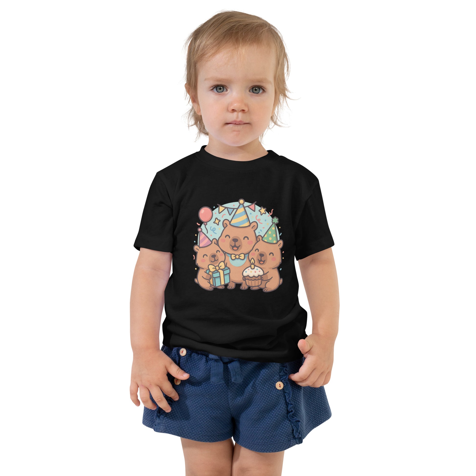 Close-up of adorable Capybara Birthday Party design with cake and balloons on a child's t-shirt