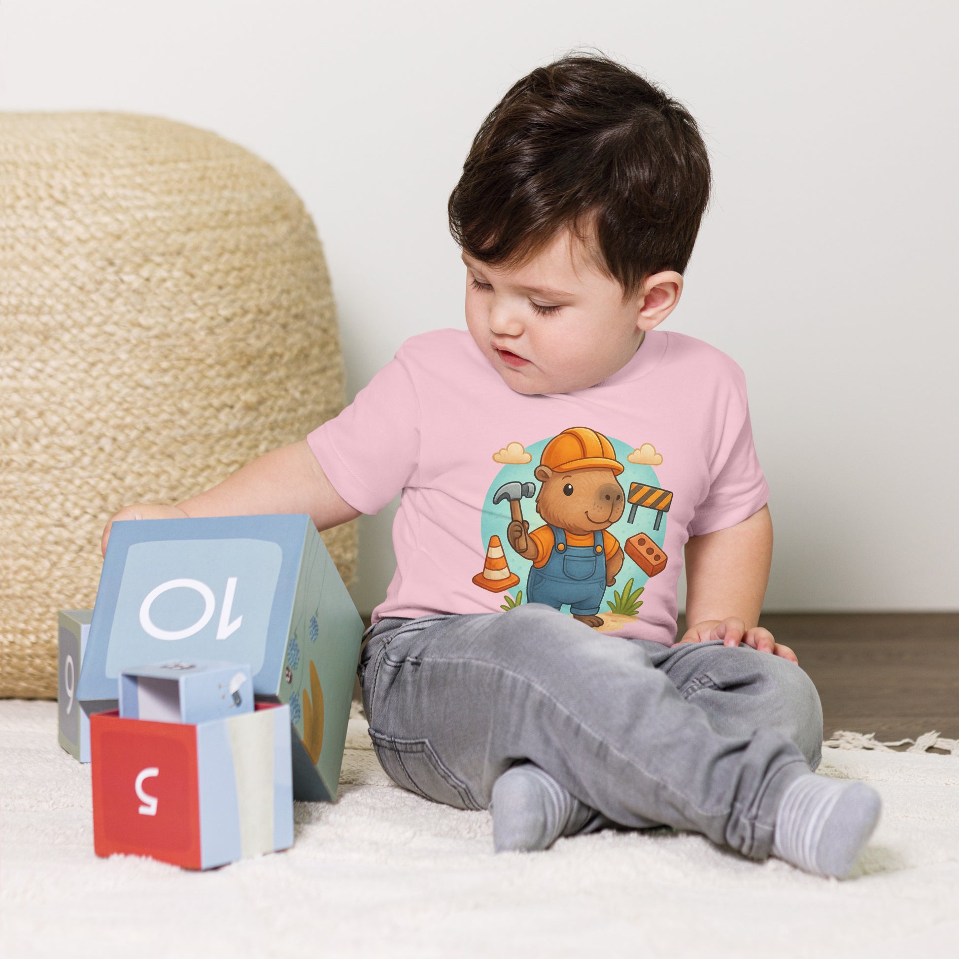 Close-up of cute Capybara Builder design with tools on a child's t-shirt