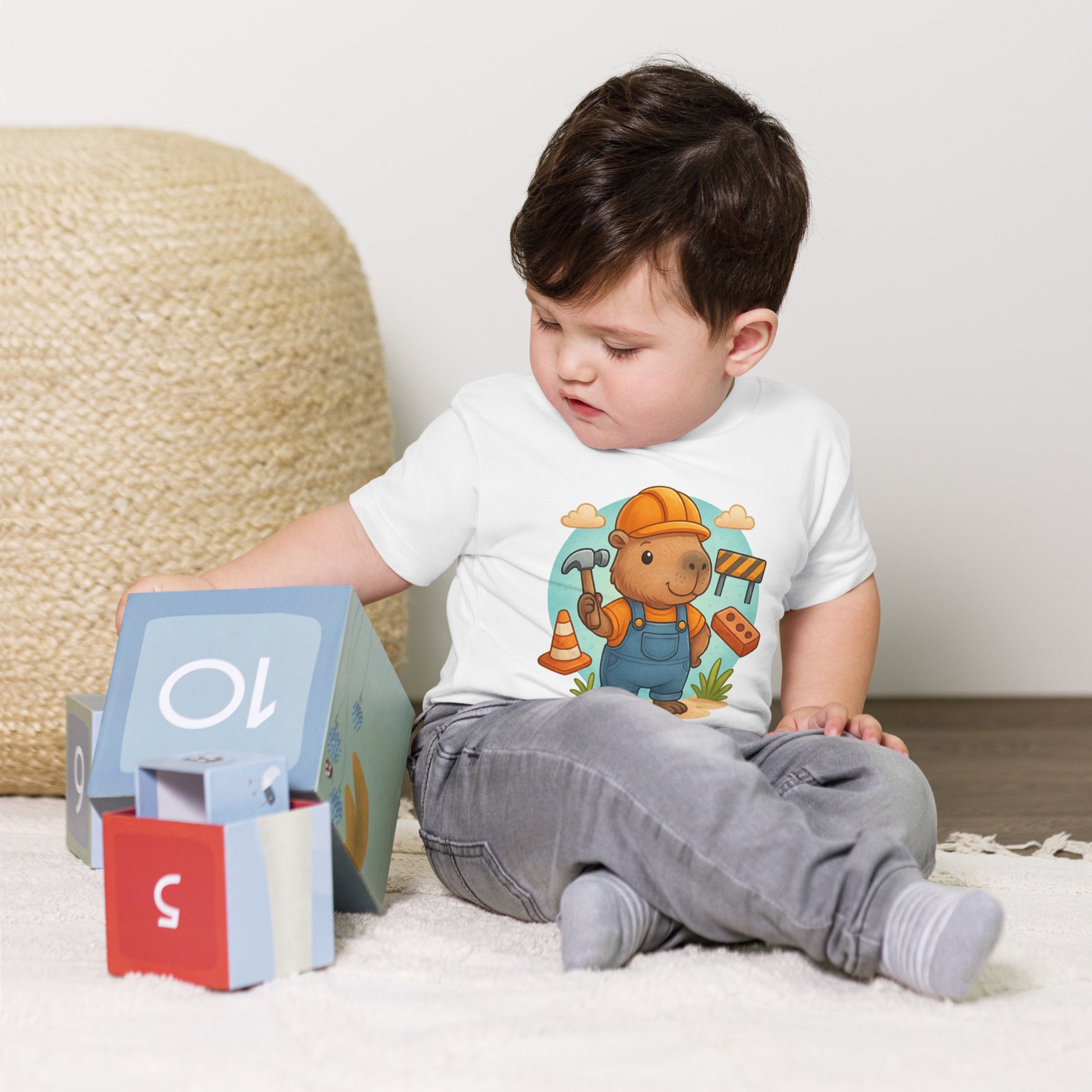 Close-up of cute Capybara Builder design with tools on a child's t-shirt